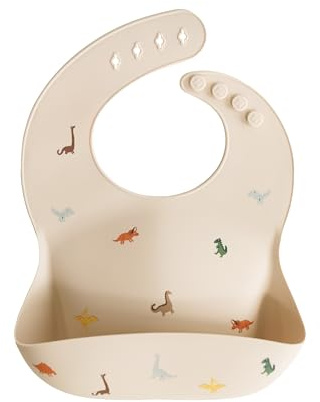 mushie Babero de Silicona para Bebés | Baberos de Alimentación con Bolsillo | Fáciles de Lavar | 4 Tamaños Ajustables | Sin BPA | Accesorio Durable para Niños Pequeños y Niñas | Dinosaurs