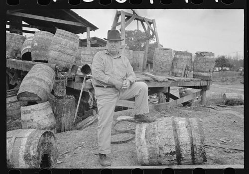 HistoricalFindings Photo: Owner in Front of his Turpentine Still,State Line,Mississippi,MS,FSA,1938