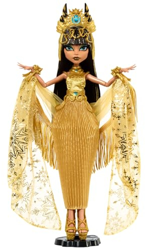 Monster High Howliday Cleo De Nile Muñeca, muñeca Coleccionable de edición Invernal con Vestido Dorado, Accesorios relucientes y Chal de Flecos Brillante, HXJ00