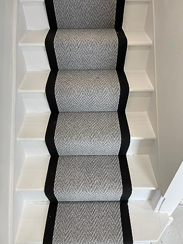 Grey carpet stair runner with black taped edge