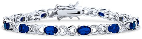 Bling Jewelry Pulsera de tenis para mujer con circonita cúbica simulada de zafiro azul oscuro de 9CT AAA ovalada CZ símbolo de infinito milgrain, chapada en plata.