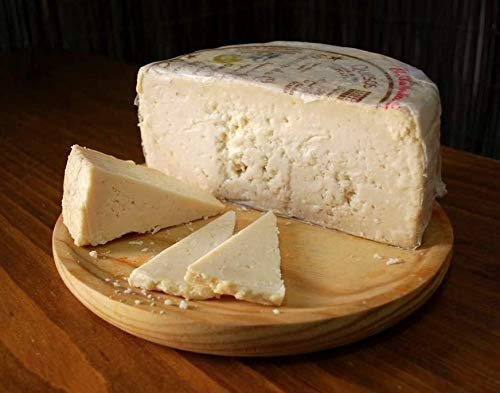 1/2 QUESO ROMERO OCAÑA para paladares exquisitos, graso, mantecoso, con pique, granuloso y quebradizo, color ocre, debido a su larga maduración de hasta 2 años