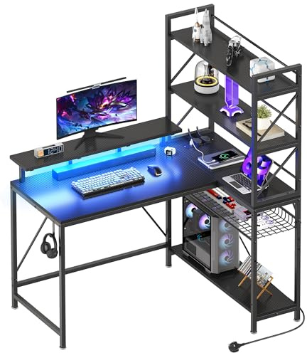 YITAHOME L Shaped Gaming Desk with Shelves Power LED 120cm Black | Reversible corner desk, storage shelves, 2 AC outlets, 2 USB, LED, hooks. Carbon fibre surface, metal frame, home office