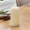 Lights4fun - TruGlow™ Candela LED con Fiamma Tremolante, a Pile in Vera Cera Bianco Avorio, 15cm x 7,5cm