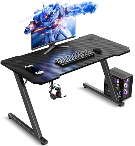 TRIUMPHKEY Gaming Desk, 100x60CM Gaming Table, Robust Ergonomic Computer Desk, Carbon Fibre Surface, Headphone and Cable Management Hook, Modern Z-Frame, Carbon Black