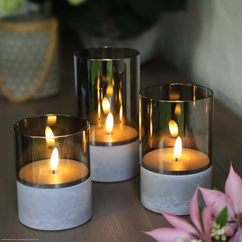 Hellum velas LED con función temporizador gris, juego de 3 en varios tamaños, velas LED de llama parpadeante, para exterior, con pilas 6xAA (no incl.) 10/12,5/15 x8cm (HxØ) 151992