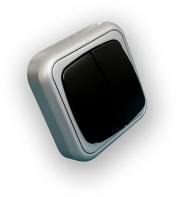 Doble interruptor de superficie, color plata-gris, ideal para controlar dos circuitos eléctricos de manera eficiente y práctica.