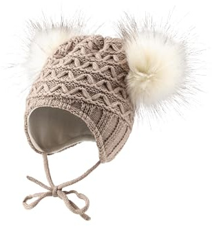 Sterntaler Strickmütze mit Bommeln aus Kunstpelz - Mädchen Mütze mit tollem Strickmuster - Babymütze mit Futter aus weichem Baumwolljersey - Wintermütze mit Ohrenklappen und Bindeband - Sand,39