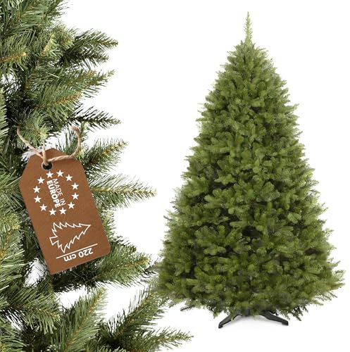 KADAX Albero di Natale artificiale in PVC, abete rosso con supporto in plastica da 220 cm, albero realistico, diametro ca. 130, albero con 92 rami e 18 corone (luce forestale 220 cm)