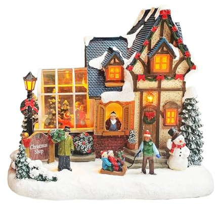 MOMENTS IN TIME Christmas Village Building Lighted Christmas Shop with LED Lights, Music & Snowman Battery Operated or Plug-in Vintage Holiday Village House Décor 8.5”H x 9.8”W x 6.9”D