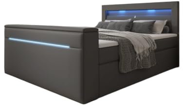 Luxusbetten24 Boxspringbett Reposito 180x200 Doppelbett Polsterbett Bett mit TV Lift, USB, LED und Stauraum | Bezug: Kunstleder | Farbe: Grau | Härtegrad: H4 (100kg+)
